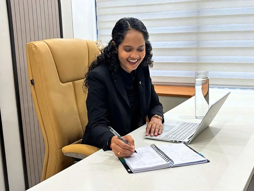Riddhi writing notes at her desk at The Diet Bliss clinic