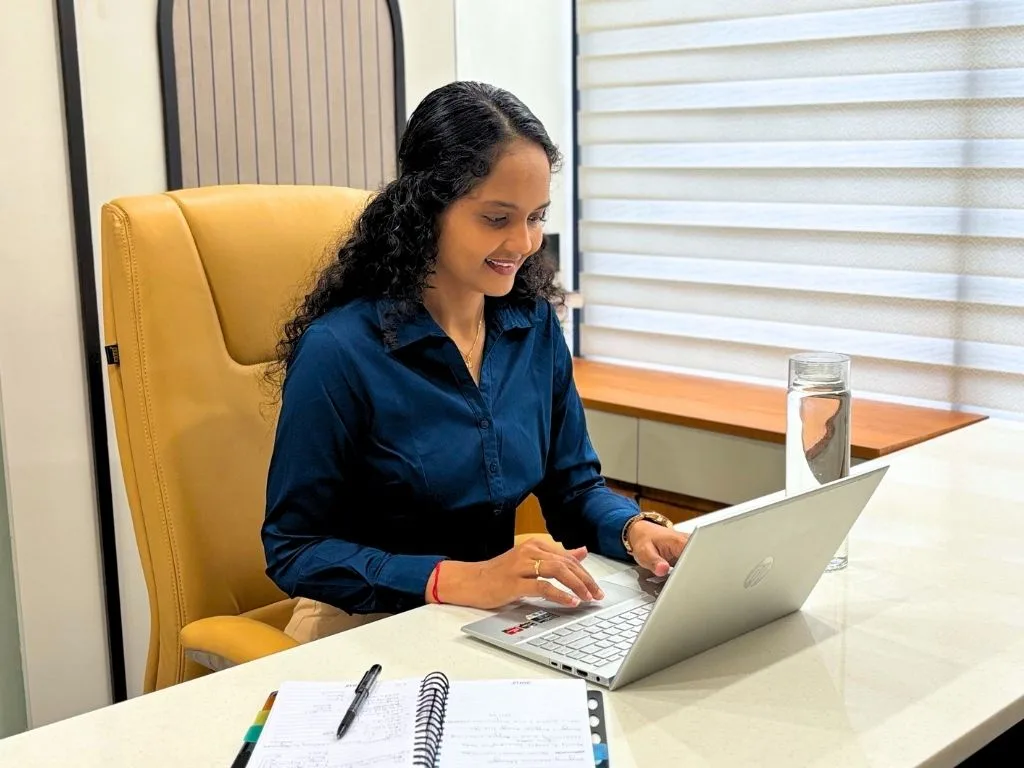 Riddhi taking an online consultation at her desk at The Diet Bliss clinic